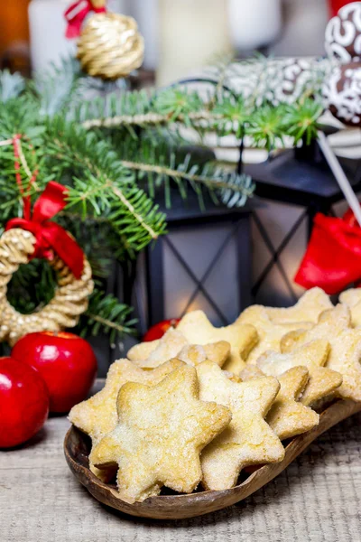 Homemade cookies in star shape on wooden table in christmas eve — Stock Photo, Image