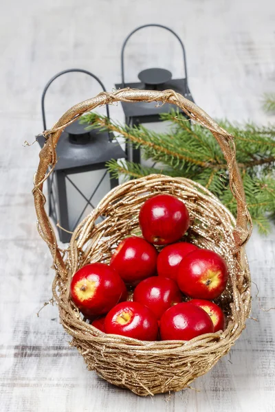 Basket of red apples on wooden table — Stock Photo, Image