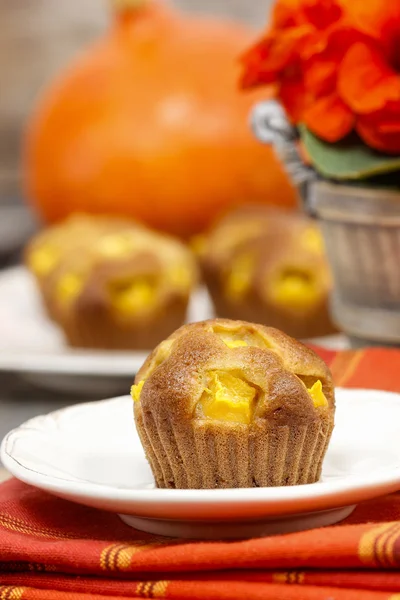 Pumpkin muffins on wooden table in autumn setting. Halloween — Stock Photo, Image