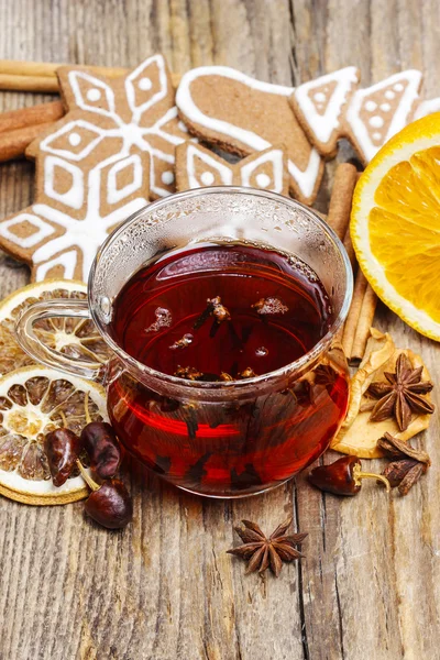 Gingerbread cookies, candle and cinnamon sticks — Stock Photo, Image