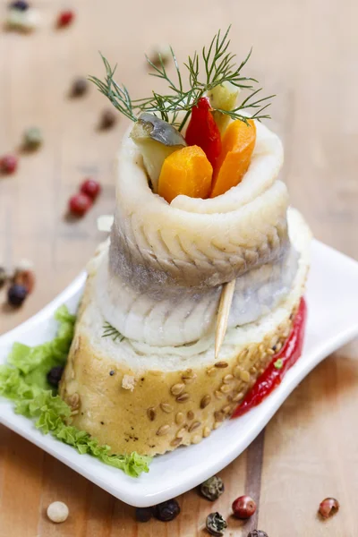 Pickled herring rolls with vegetables — Stock Photo, Image