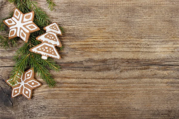 Vánoční cookies na dřevěném pozadí — Stock fotografie