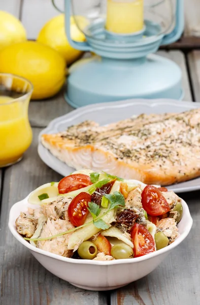 Salmon salad on wooden table — Stock Photo, Image