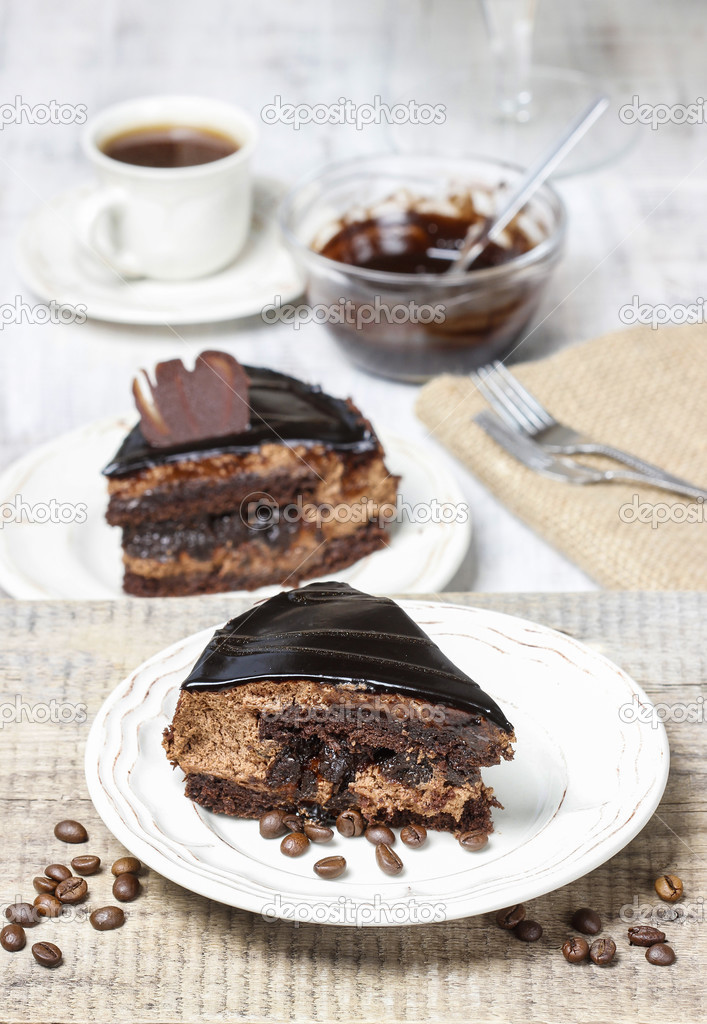 Piece of chocolate cake on wooden table