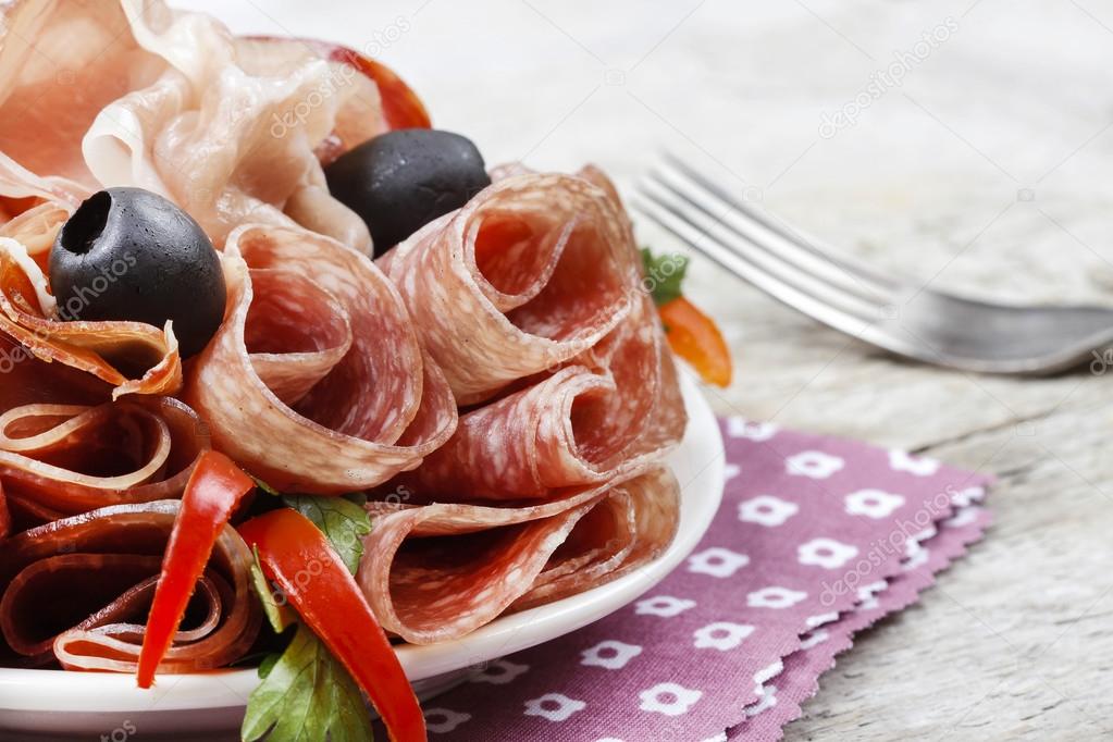 Delicious sliced ham. Party platter of assorted cured meats