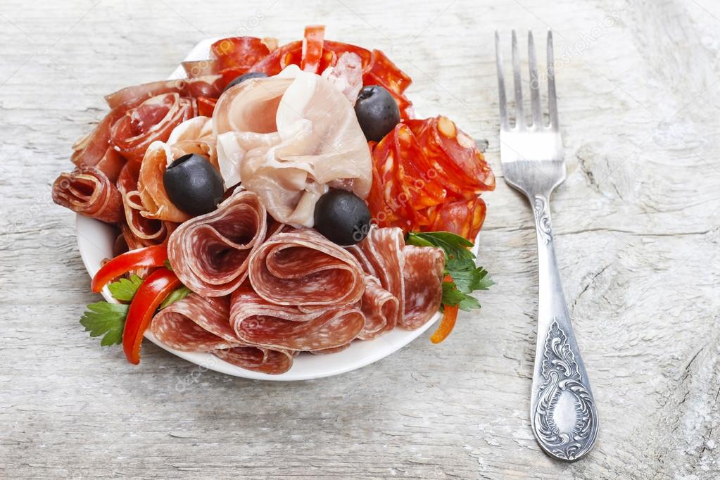 Delicious sliced ham. Party platter of assorted cured meats
