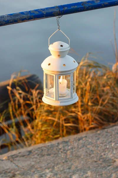 Beautiful white lantern hanging at the handrail — Stock Photo, Image