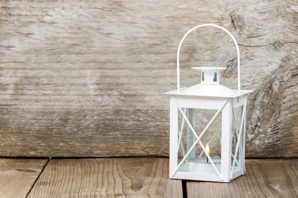 Simple white lantern on wooden background — Stock Photo, Image