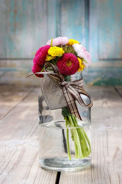 Bouquet of wild flowers in glass vase — Stock Photo, Image