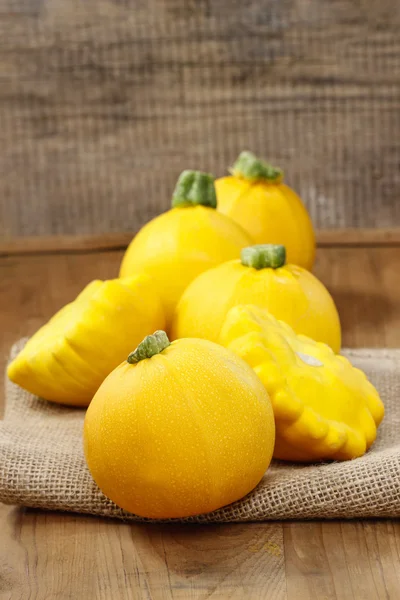 Yellow pumpkins on wooden table — Stock Photo, Image