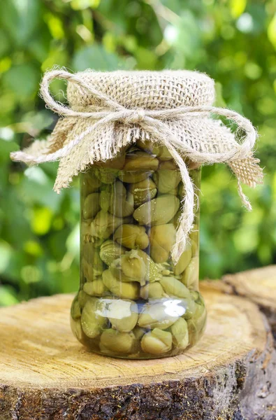 Pickled capers in glass jar — Stock Photo, Image