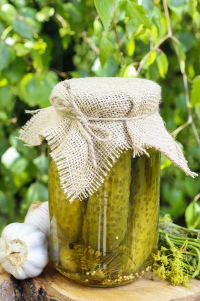 Pickled cucumbers in glass jar — Stock Photo, Image