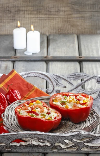 Red pepper stuffed with rice and vegetables on wicker tray. — Stock Photo, Image