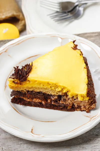 Piece of chocolate layer cake on white ceramic plate — Stock Photo, Image