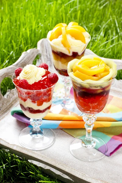 Layer fruit desserts on wooden tray. Summer garden party — Stock Photo, Image