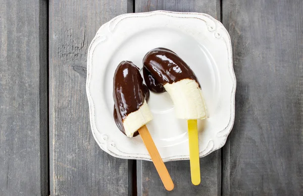 Top view of chocolate dipped bananas — Stock Photo, Image