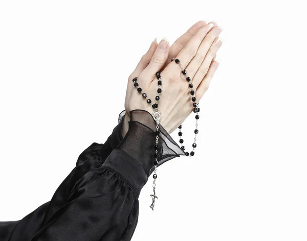 Hands holding black rosary isolated on white background. — Stock Photo, Image