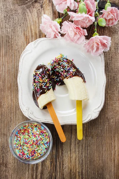 Top view of chocolate dipped bananas — Stock Photo, Image