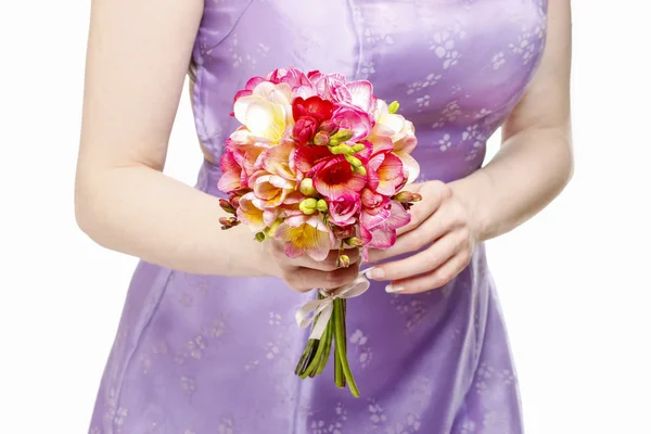 Beautiful young woman holding bouquet of flowers, isolated on wh — Stock Photo, Image