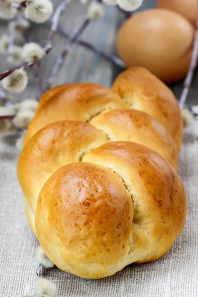 Easter bun on wooden table — Stock Photo, Image