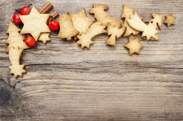 Karácsonyi cookie-kat a fából készült háttér. másol hely, üres fedélzeten — Stock Fotó