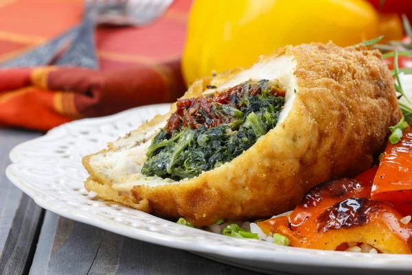Chicken roll stuffed with spinach and dried tomatoes — Stock Photo, Image