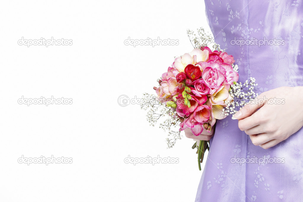 Beautiful young woman holding bouquet of flowers, isolated on wh