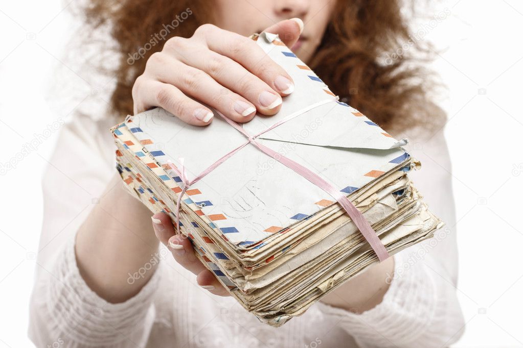Woman holding package of vintage letters