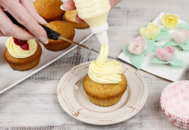Woman making cupcakes clipart