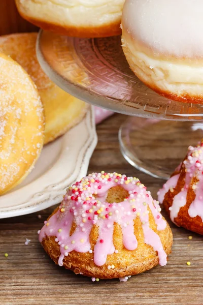 Easter yeast cake and donuts on wooden table. Traditional recipe — Stock Photo, Image