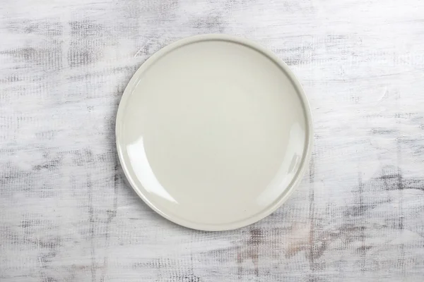 Top view empty plate on rustic wooden table — Stock Photo, Image