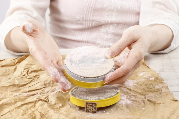 Woman holding vintage compact powder in beautiful hands — Stock Photo, Image