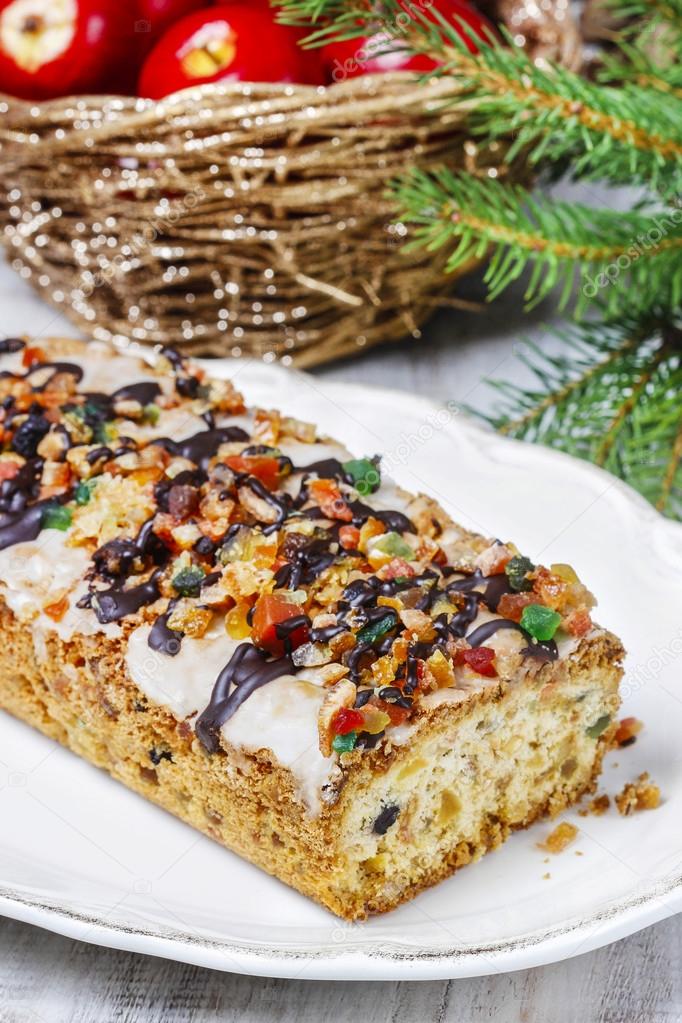 Fruitcake with dried fruits and nuts in christmas setting