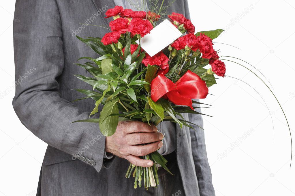 Man holding bouquet of red carnations