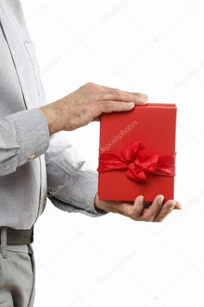 Man gives a book as a present