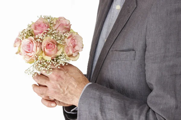 Man holding bouquet of pink roses — Stock Photo, Image