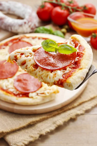Italian cuisine: pizza with salami — Stock Photo, Image