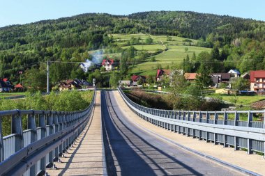 Bridge over the river in LUBIEN, Poland.