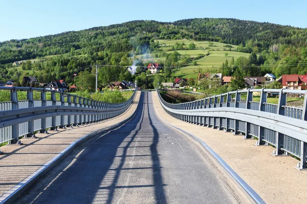 Bridge over the river in LUBIEN, Poland.