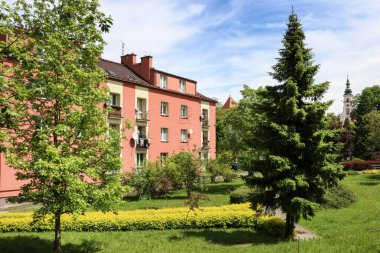 A multi-family residential building surrounded by a park in Wieliczka, Poland.