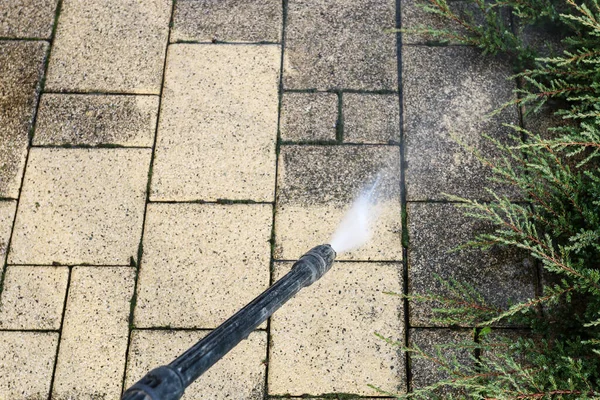 Cleaning Dirty Paving Stones Garden Pressure Washer Home Worker — стоковое фото