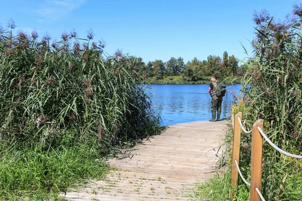 Recreation center by the lake, where wooden jetties float on the water.