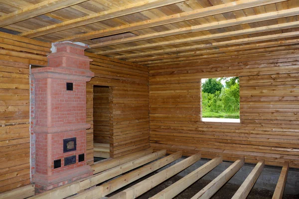 Dřevo Interiér domu s troubou a podlahové hranoly ve výstavbě Royalty Free Stock Obrázky