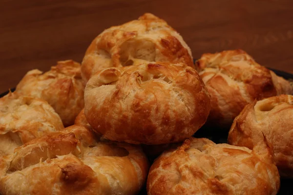 Fresh puffs on a tray on a table closeup view — Stock Photo, Image