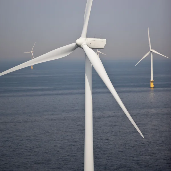 White wind turbine generating electricity — Stock Photo, Image