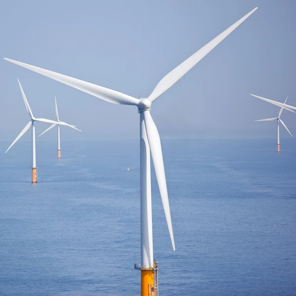 White wind turbine generating electricity — Stock Photo, Image