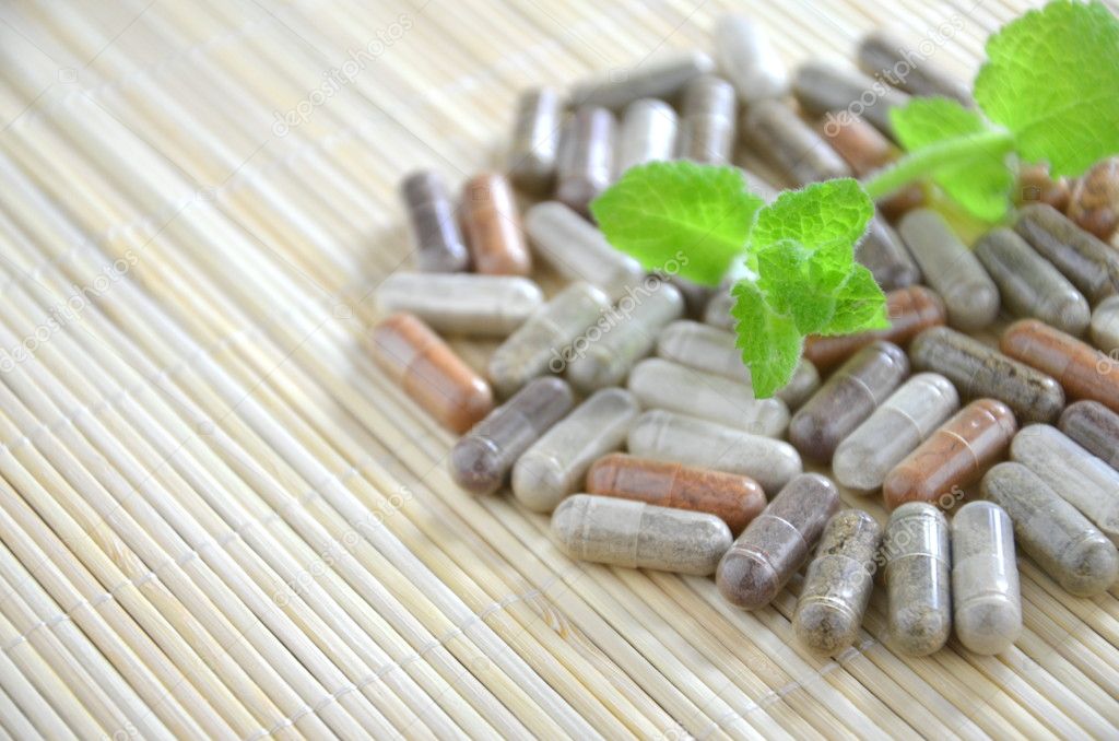 herbal capsules with mint leaves