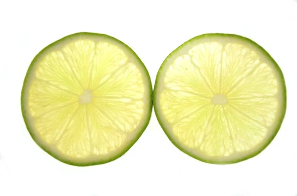 Slices of lime isolated on white background — Stock Photo, Image
