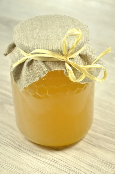 Jar full of fresh delicious honey — Stock Photo, Image