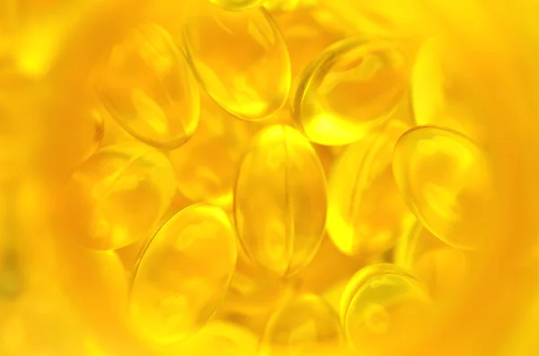 Fish oil capsules in a bottle — Stock Photo, Image